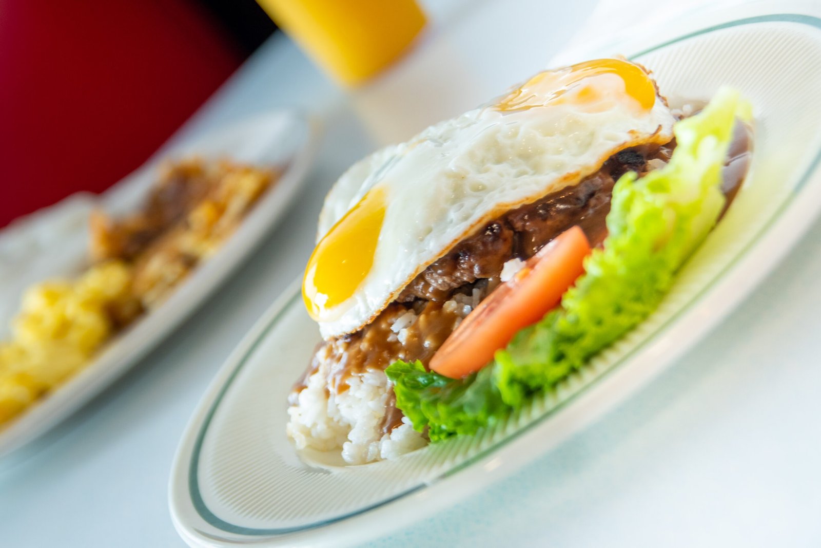 Hawaiian-style Loco Moco breakfast with rice, hamburger patty, fried egg, and gravy at Tasty Munch in Houston