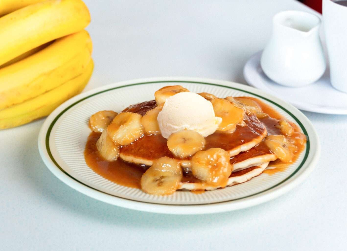 Delicious Banana Foster dessert with caramelized bananas and rich sauce at Tasty Munch.