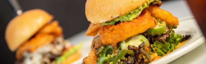 Fuego Burger with jalapeños, melted pepper jack cheese, and spicy sauce at Tasty Munch.